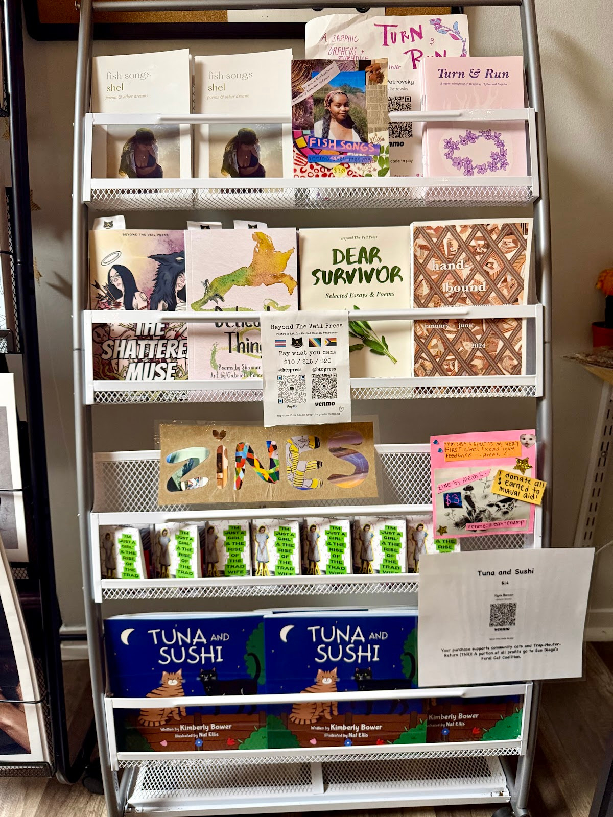 The zine rack at The Feminist Bookstore.